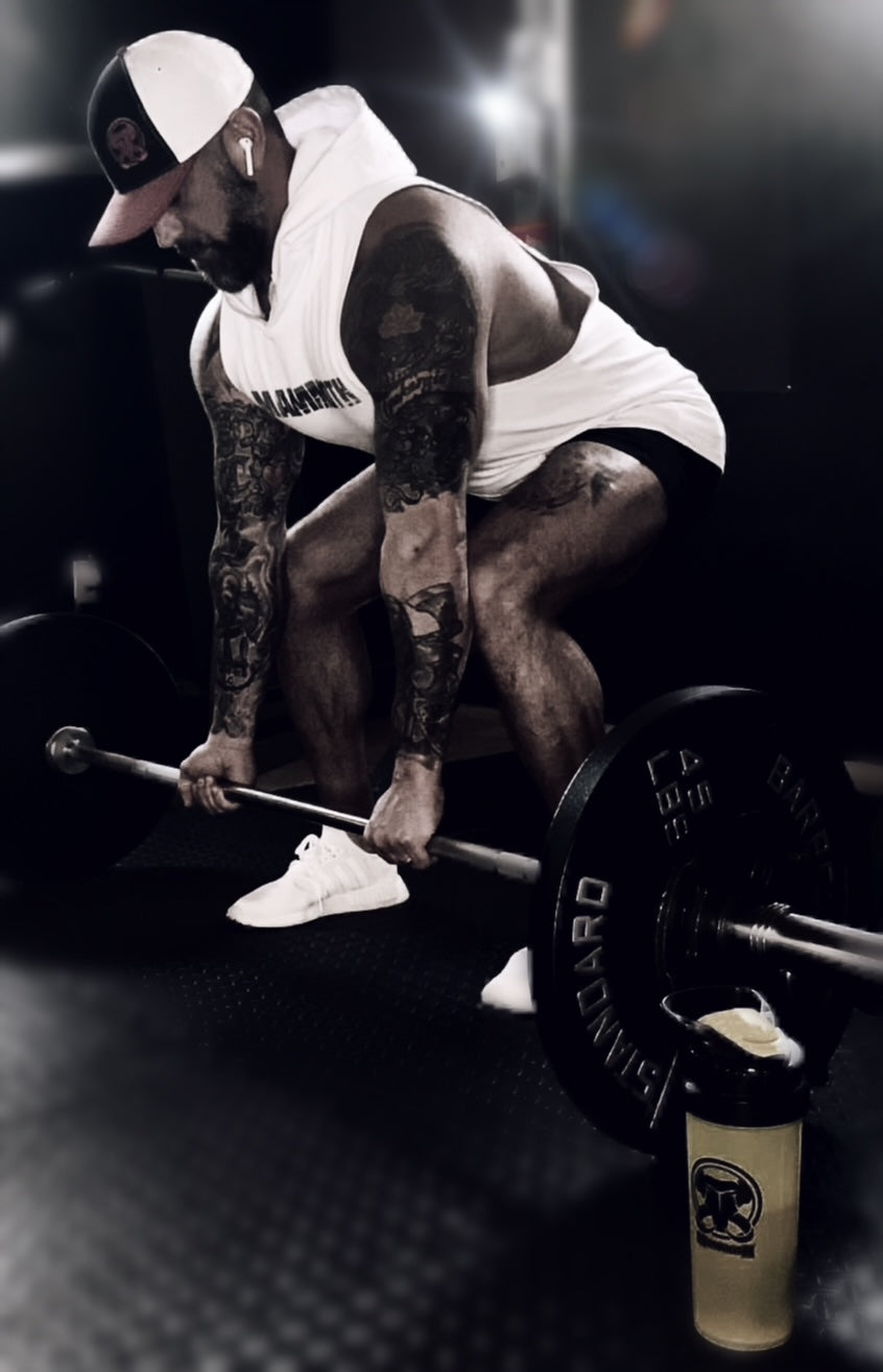 MAMMOTH White drop Sleeveless Hoodie. Show off your hard work at the gym or home workout. Weight training apparel. Bodybuilding. Men's Fitness Apparel. Canada. Men's training tank.  Edit alt text