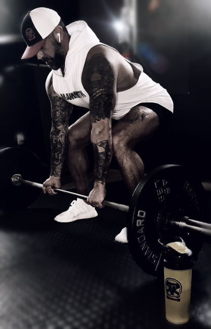 MAMMOTH White drop Sleeveless Hoodie. Show off your hard work at the gym or home workout. Weight training apparel. Bodybuilding. Men's Fitness Apparel. Canada. Men's training tank.  Edit alt text