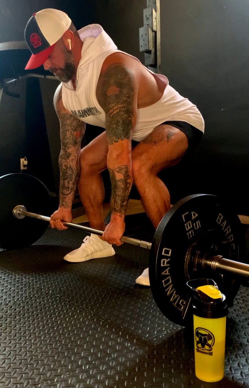 MAMMOTH White drop Sleeveless Hoodie. Show off your hard work at the gym or home workout. Weight training apparel. Bodybuilding. Men's Fitness Apparel. Canada. Men's training tank.  Edit alt text